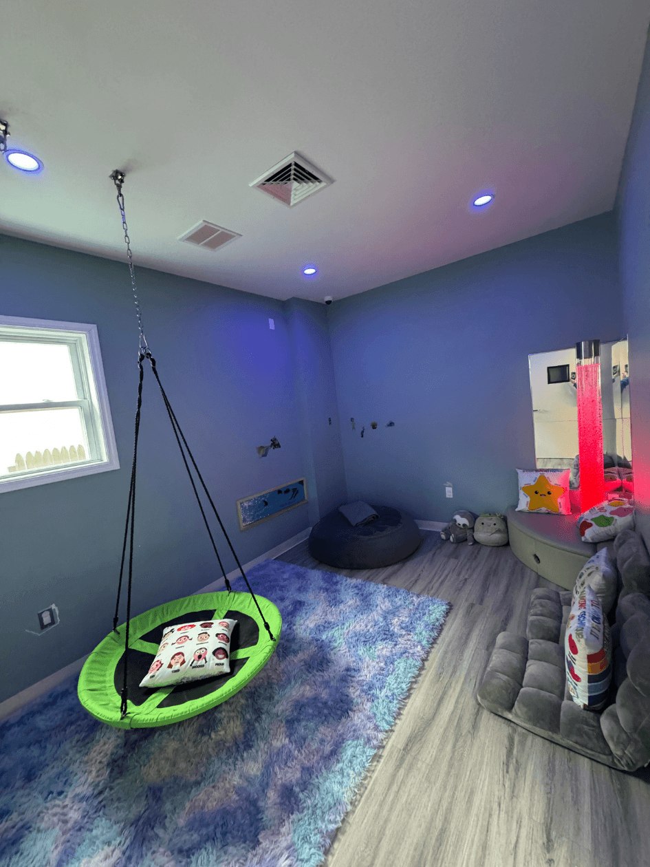 Colorful sensory room with swing
