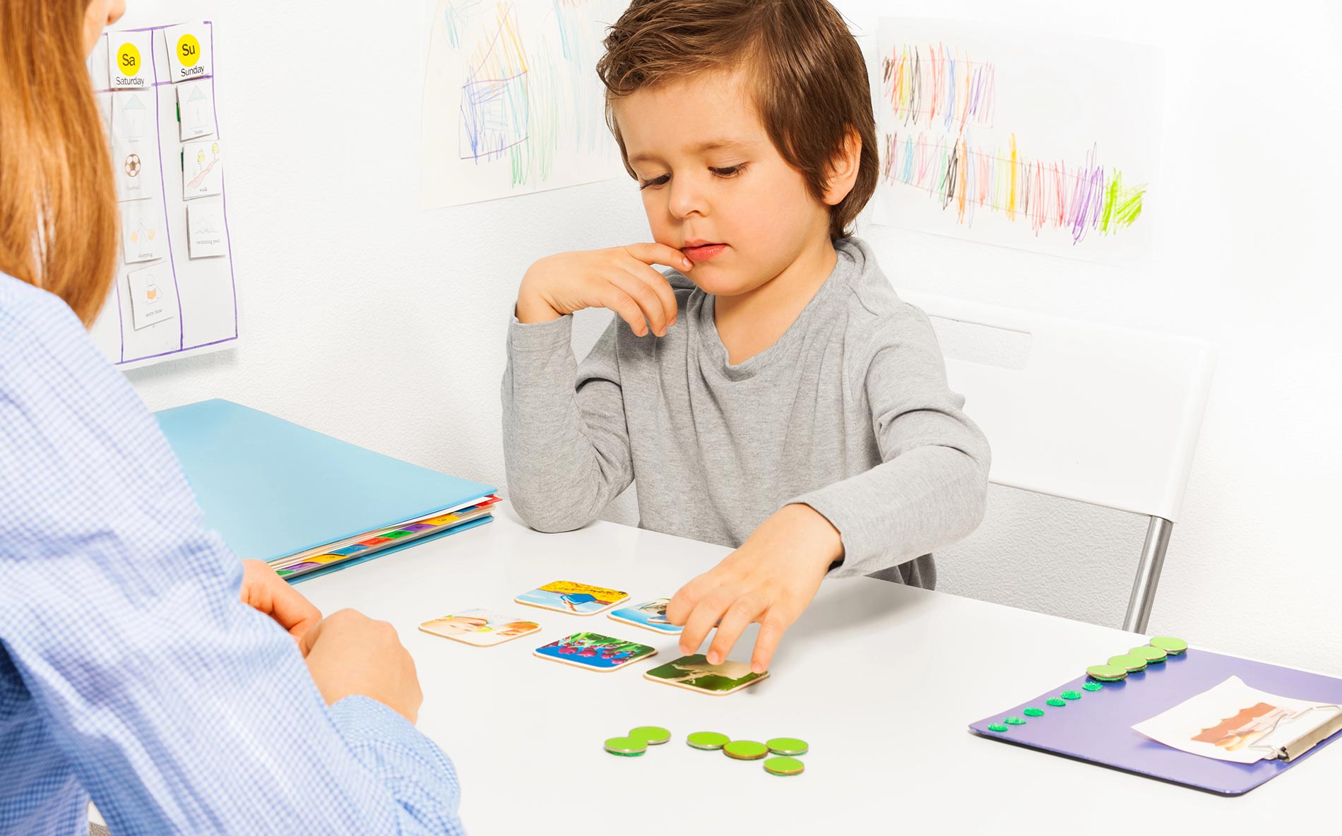Child playing a card game.